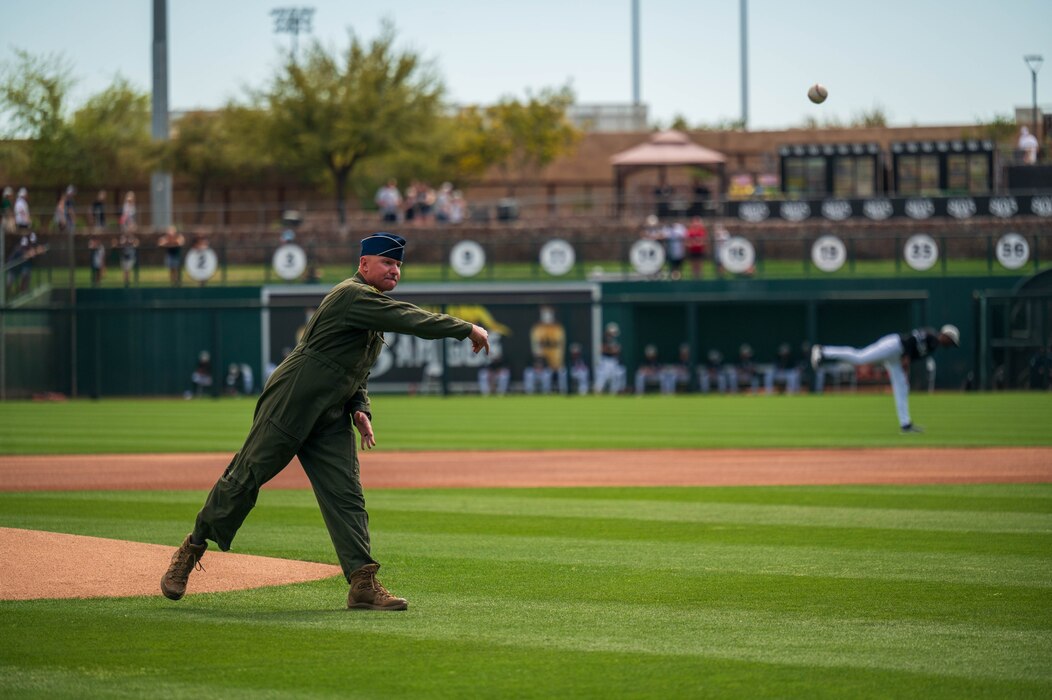 U.S. Air Force Brig. Gen. David Berkland, 56th Fighter Wing commander, throws out the first pitch during the 2025 Military Appreciation game, March 23, 2025 at the Camelback Ranch baseball complex, Glendale, Arizona.