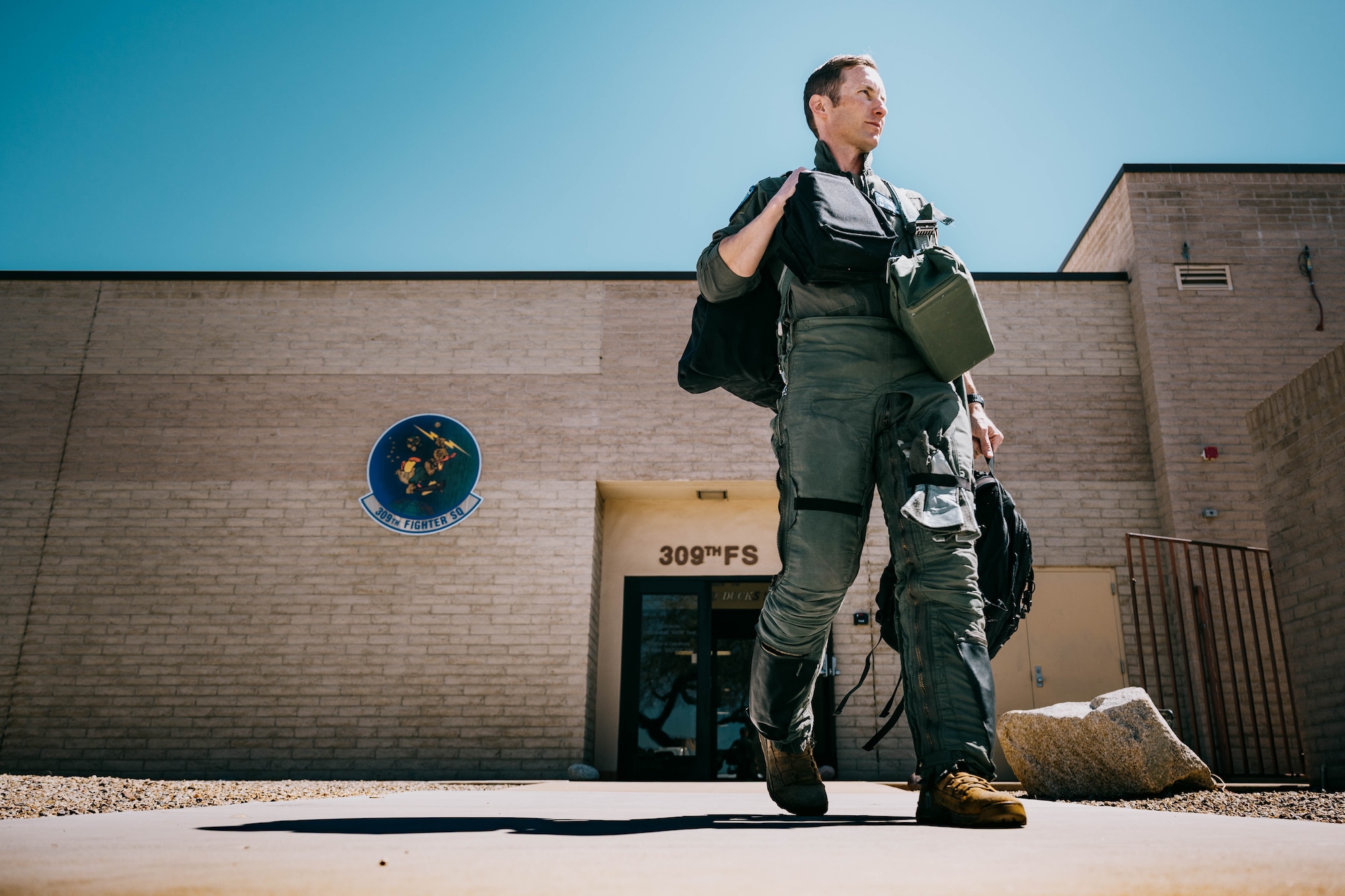 U.S. Air Force Lt. Col. Michael Ress, 309th Fighter Squadron commander, walks out of the 309th FS to pilot the final U.S. F-16 Fighting Falcon.