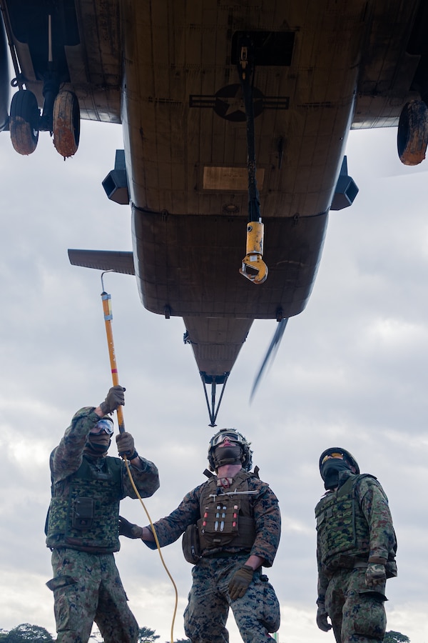 U.S. Marine Corps Cpl. Riley Wharton, a logistics specialist with Combat Logistic Company Bravo, Combat Logistics Battalion 31, 31st Marine Expeditionary Unit, center, and Japan Ground Self-Defense Force members with 1st Amphibious Rapid Deployment Regiment, prepare to attach a sling during an external lift exercise in support of Iron Fist 25, at Camp Hansen, Okinawa, Japan, Feb. 22, 2025. Iron Fist is an annual bilateral exercise designed to increase interoperability and strengthen the relationships between the U.S Marine Corps, U.S. Navy and Japan Ground Self-Defense Force. The 31st Marine Expeditionary Unit, the Marine Corps’ only continuously forward deployed MEU, provides a flexible and lethal force, ready to perform a wide range of military operations as the premier crisis response force in the Indo-Pacific region. Wharton is a native of Texas. (U.S. Marine Corps photo by Lance Cpl. Raul Sotovilla)