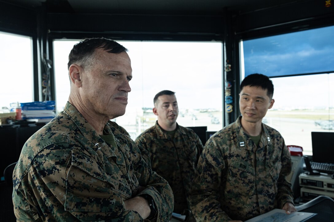 U.S. Marine Corps Maj. Gen. Brian N. Wolford, left, commanding general of Marine Corps Installations Pacific, tours an air traffic control tower during Exercise Resolute Response 25 on Marine Corps Air Station Futenma, Okinawa, Japan, Feb. 27, 2025. Resolute Response is a two-week training exercise to test base defenses through the enhanced response of the MCAS Futenma Emergency Operations Center. An EOC provides a commanding officer with single point command and control of installation facilities, resources, and support functions during an emergency in order to maintain situational awareness and support timely decision-making. Wolford is a native of Maryland. (U.S. Marine Corps photo by Lance Cpl. Brody Robertson)