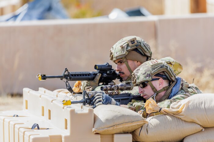 Senior Airman Hernan Bahena, 88th Security Forces Squadron, and Staff Sgt. Grant Baker, 412th SFS, secure their area during the 412th Security Forces Squadron’s Advanced Combat Training Exercise at Edwards Air Force Base, California, March 14. (Air Force photo by James West)