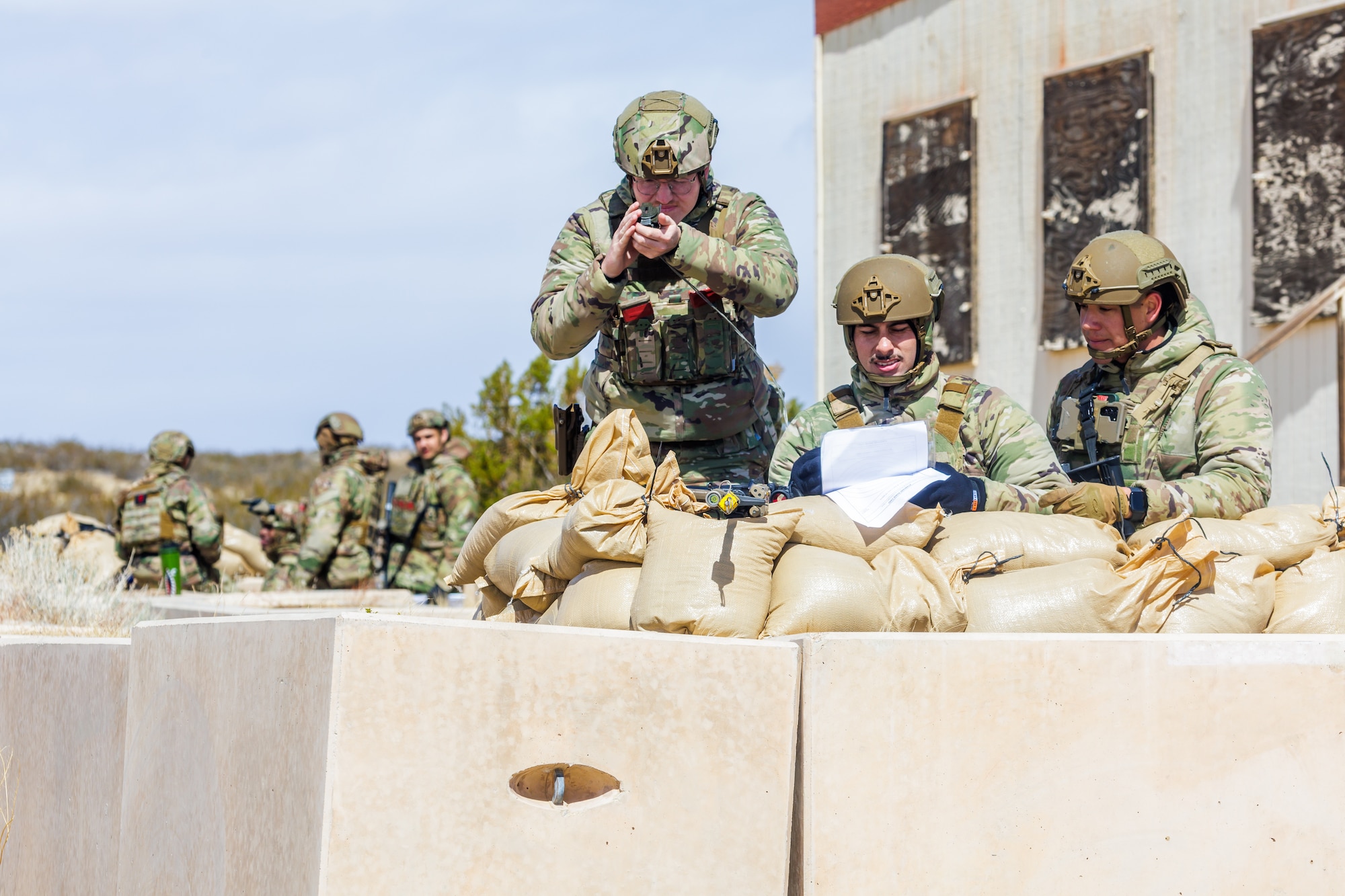 Senior Airman Christian Higgenbotham, 30th Security Forces Squadron, uses a compass during the 412th Security Forces Squadron’s Advanced Combat Training Exercise at Edwards Air Force Base, California, March 14. (Air Force photo by James West)