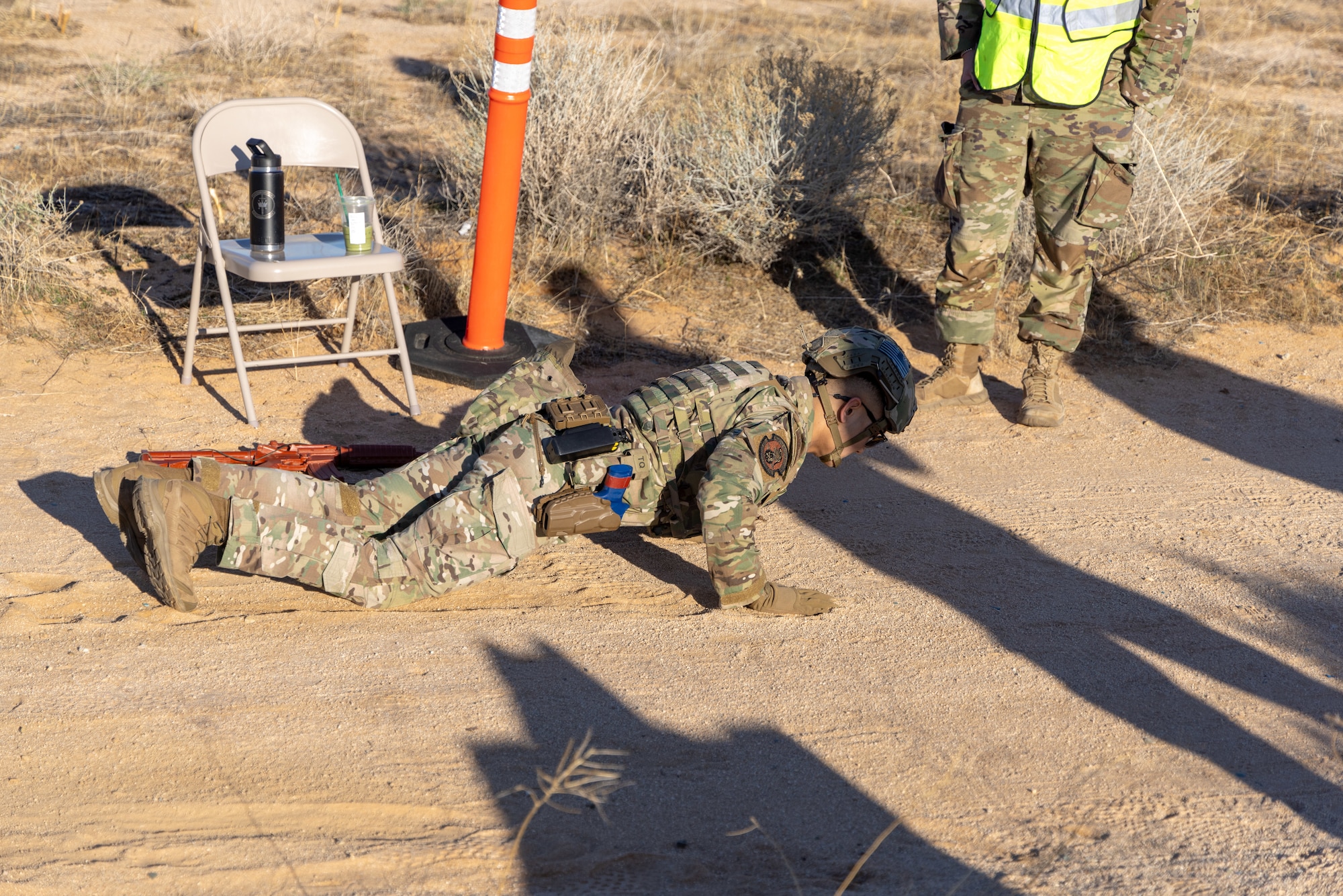 Staff Sgt. Ratha Lay, 436th Security Forces Squadron, out of Dover Air Force Base, conducts pushups during the physical fitness assessment phase the 412th Security Forces Squadron’s Advanced Combat Training Exercise at Edwards Air Force Base, California, March 10 (Air Force photo by Daniel Kelley)