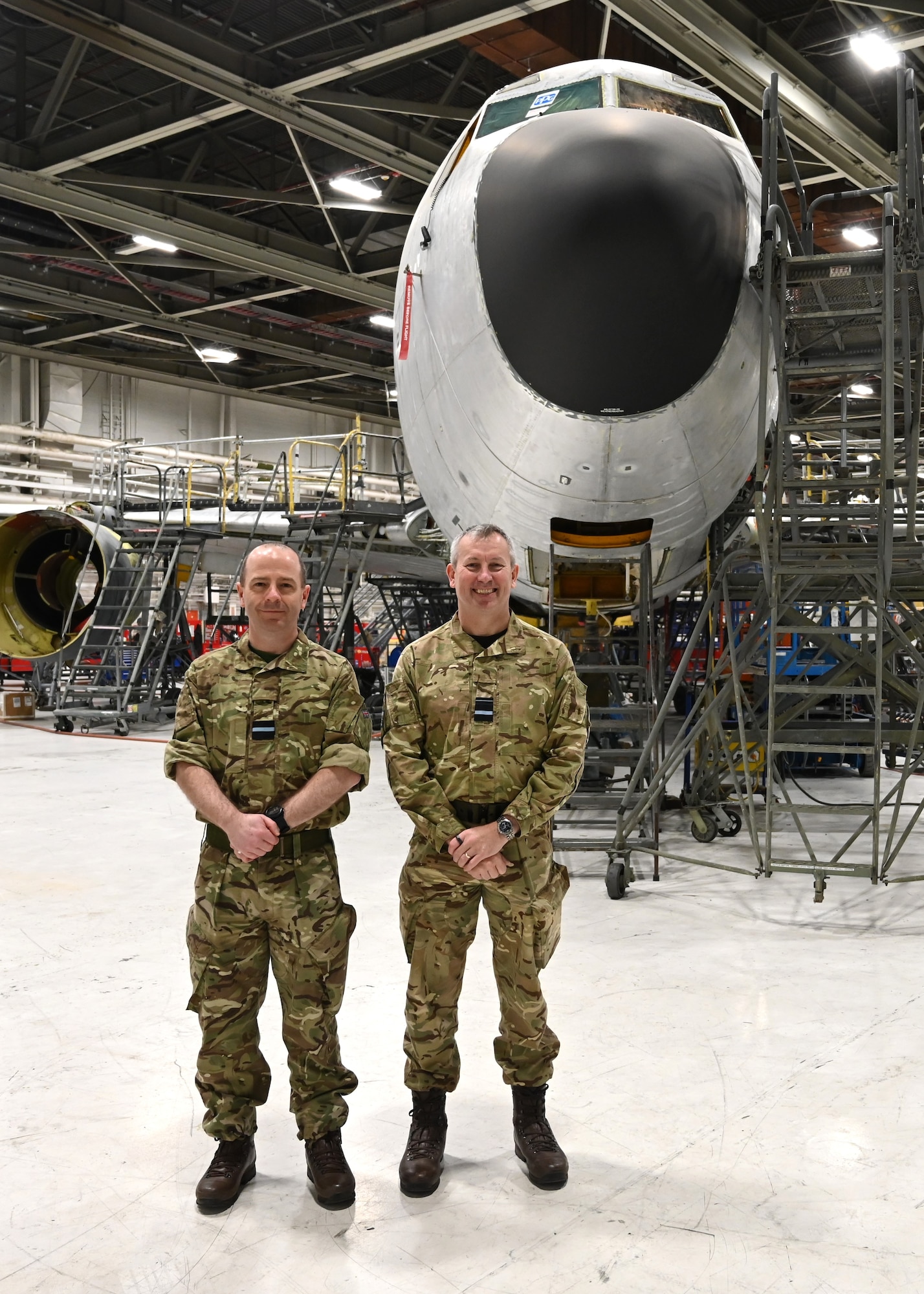 2 men standing next to each other in Royal Air Force uniforms