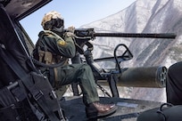 U.S. Marine Corps Cpl. Tristan Walker, a helicopter crew chief with Marine Light Attack Helicopter Squadron (HMLA) 267, Marine Aircraft Group 36, 1st Marine Aircraft Wing, sights in on an M2 machine gun during a simulated close air support (SIMCAS) exercise during Korean Marine Exchange Program 25.1, in South Korea, March 11, 2025. SIMCAS are training exercises to provide ground combat with aerial support. KMEP is a semi-annual exercise that provides iterative opportunities for Republic of Korea Marine Corps and U.S. Marine Corps units to train together, improving their combined capabilities to deter threats and maintain peace on the Korean Peninsula. (U.S. Marine Corps photo by Lance Cpl. Yanisa Culp)