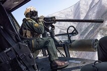 U.S. Marine Corps Cpl. Tristan Walker, a helicopter crew chief with Marine Light Attack Helicopter Squadron (HMLA) 267, Marine Aircraft Group 36, 1st Marine Aircraft Wing, sights in on an M2 machine gun during a simulated close air support (SIMCAS) exercise during Korean Marine Exchange Program 25.1, in South Korea, March 11, 2025. SIMCAS are training exercises to provide ground combat with aerial support. KMEP is a semi-annual exercise that provides iterative opportunities for Republic of Korea Marine Corps and U.S. Marine Corps units to train together, improving their combined capabilities to deter threats and maintain peace on the Korean Peninsula. (U.S. Marine Corps photo by Lance Cpl. Yanisa Culp)