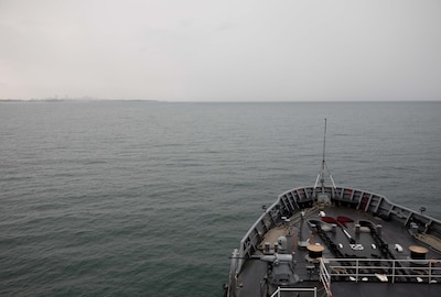 DARWIN, Northern Territory, Australia (Mar. 25, 2025) – Submarine tender USS Emory S. Land (AS 39) sails toward Darwin, Northern Territory, Australia, for a regularly scheduled port visit, Mar. 25, 2025. Darwin is Emory S. Land’s 17th port call since it departed on deployment May 17, 2024. Emory S. Land is on deployment supporting the U.S. 7th Fleet, the U.S. Navy’s largest forward deployed numbered fleet, operating with allies and partners in preserving a free and open Indo-Pacific region. (U.S. Navy photo by Mass Communication Specialist 1st Class Ian Zagrocki)