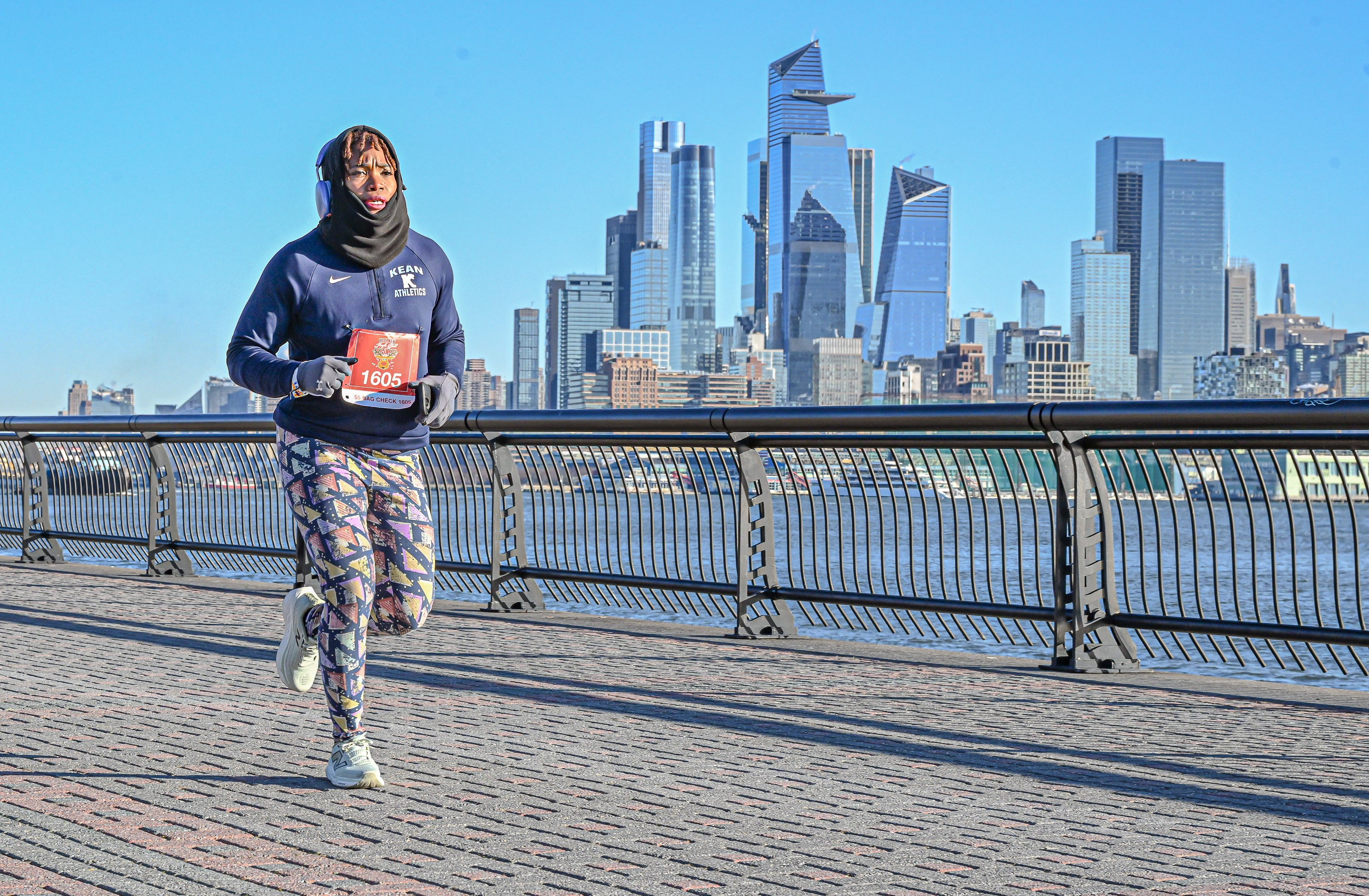 Master Sgt. Danielle Todman runs beside the East River with the Manhattan skyline in the background. Todman was recently announced as the 2024 Department of the Air Force Female Athlete of the Year. (Courtesy photo)
