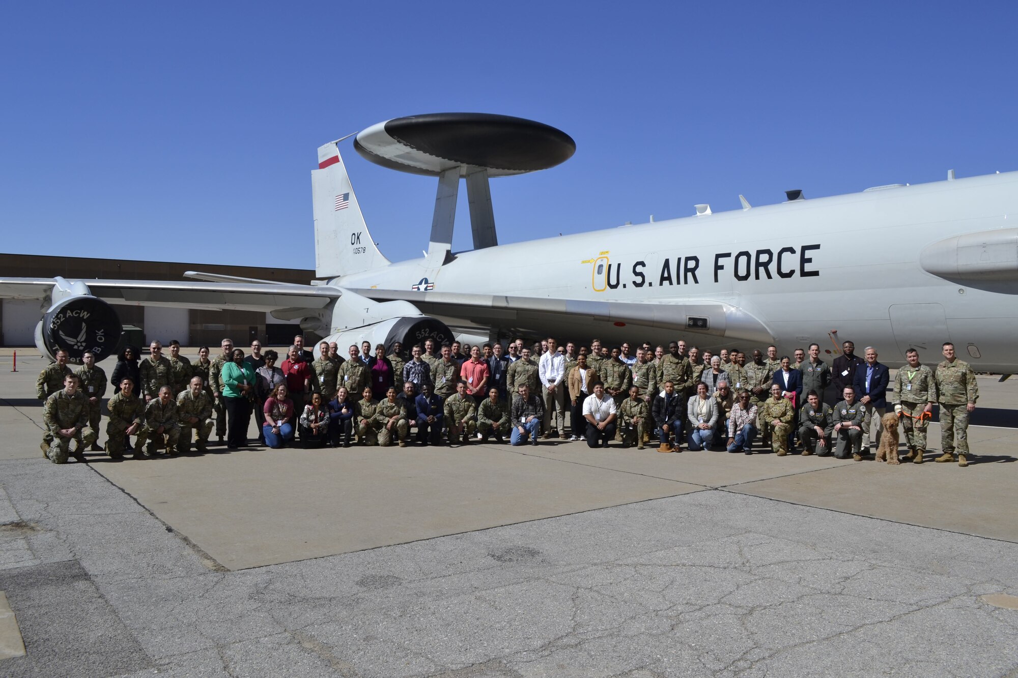 Group of people standing in front of E-3 Sentry aircraft