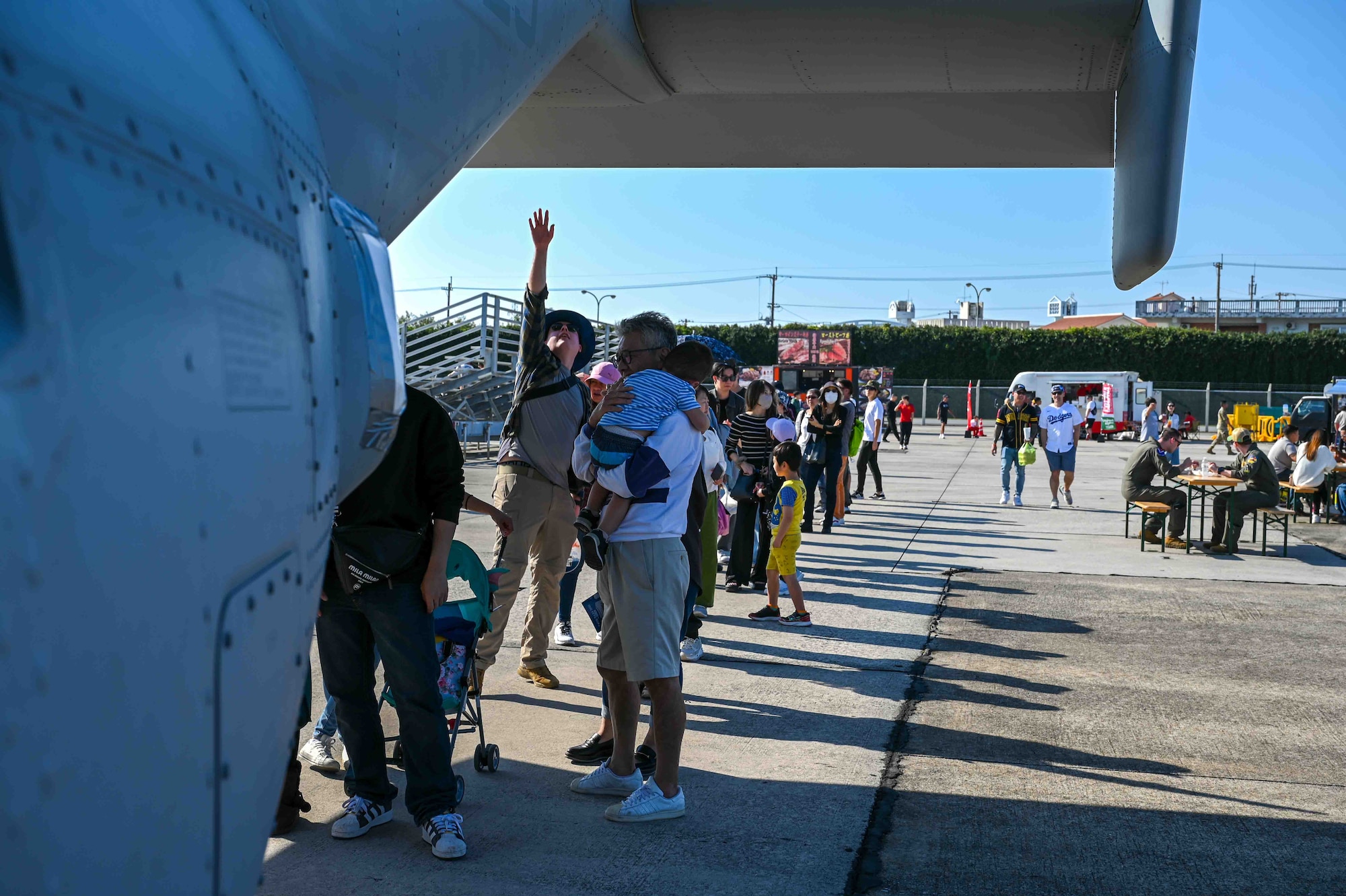Guests line up to enter an aircraft