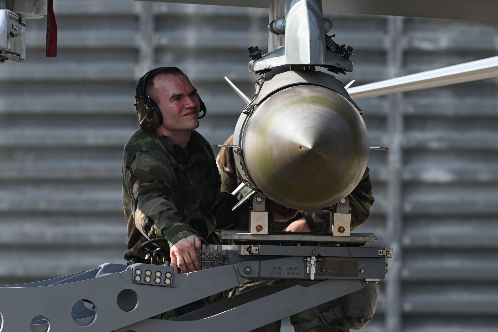 U.S. Air Force Staff Sgt. Anthony Godlewski, 35th Fighter Generation Squadron weapons load crew, inspects a loaded munition during an integrated combat turn for Freedom Shield 25 at Gwangju Air Base, Republic of Korea.