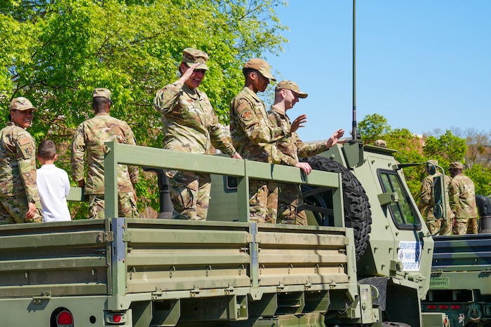Col. Sandra Bonney, 461st Air Control Wing deputy commander, salutes attendees at the 2025 International Cherry Blossom Festival parade in downtown Macon, Georgia, March 23, 2025.