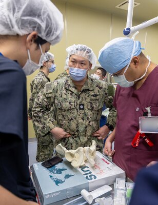 TAURA, Japan (Feb 27, 2025) Lead orthopedic surgeon, Cmdr. Benjamin Chi provided didactic and practical training on the application of external fixation pins and the physics of external fixators as well as unstable pelvic fractures during the pre-exercise team building. Japan Self-Defense Force (JSDF) Hospital Yokosuka and U. S. Navy Medicine Readiness and Training Command (NMRTC) Yokosuka personnel conduct surgical training during a joint disaster response drill. The exercise focused on enhancing hospital administrative and command staff capabilities between NMRTC Yokosuka and JSDF Hospital Yokosuka in the event of a large-scale natural disaster, such as a major earthquake. It also provided an opportunity for U.S. and Japanese medical teams to improve emergency response capabilities through collaborative triage and surgical

training. (U.S. Navy photo by Ai Hazama/USNMRTC Yokosuka Public Affairs)