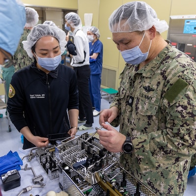 TAURA, Japan (Feb 27, 2025) Lead orthopedic surgeon, Cmdr. Benjamin Chi provided didactic and practical training on the application of external fixation pins and the physics of external fixators as well as unstable pelvic fractures during the pre-exercise team building. Japan Self-Defense Force (JSDF) Hospital Yokosuka and U. S. Navy Medicine Readiness and Training Command (NMRTC) Yokosuka personnel conduct surgical training during a joint disaster response drill. The exercise focused on enhancing hospital administrative and command staff capabilities between NMRTC Yokosuka and JSDF Hospital Yokosuka in the event of a large-scale natural disaster, such as a major earthquake. It also provided an opportunity for U.S. and Japanese medical teams to improve emergency response capabilities through collaborative triage and surgical

training. (U.S. Navy photo by Ai Hazama/USNMRTC Yokosuka Public Affairs)
