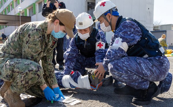 TAURA, Japan (Feb 27, 2025) Japan Self-Defense Force (JSDF) Hospital Yokosuka and U. S. Navy Medicine Readiness and Training Command (NMRTC) Yokosuka personnel conduct triage operations during a joint disaster response drill. The exercise focused on enhancing hospital administrative and command staff capabilities between NMRTC Yokosuka and JSDF Hospital Yokosuka in the event of a large-scale natural disaster, such as a major earthquake. It also provided an opportunity for U.S. and Japanese medical teams to improve emergency response capabilities through collaborative triage and surgical training. (U.S. Navy photo by Ai Hazama/USNMRTC Yokosuka Public Affairs)