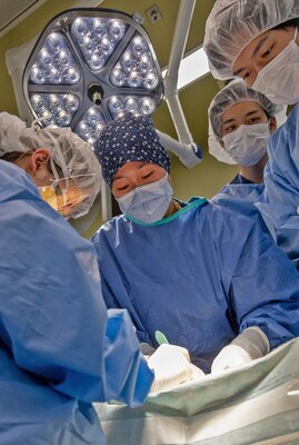 TAURA, Japan (Feb 27, 2025) General surgeon Lt. Cmdr. Angela Zah conducts a simulated exploratory laparotomy with splenectomy and small bowel resection during a joint disaster response drill for Japan Self-Defense Force (JSDF) Hospital Yokosuka and U. S. Navy Medicine Readiness and Training Command (NMRTC) Yokosuka. The exercise focused on enhancing hospital administrative and command staff capabilities between NMRTC Yokosuka and JSDF Hospital Yokosuka in the event of a large-scale natural disaster, such as a major earthquake. It also provided an opportunity for U.S. and Japanese medical teams to improve emergency response capabilities through collaborative triage and surgical training. (U.S. Navy photo by Daniel Taylor/USNMRTC Yokosuka Public Affairs)