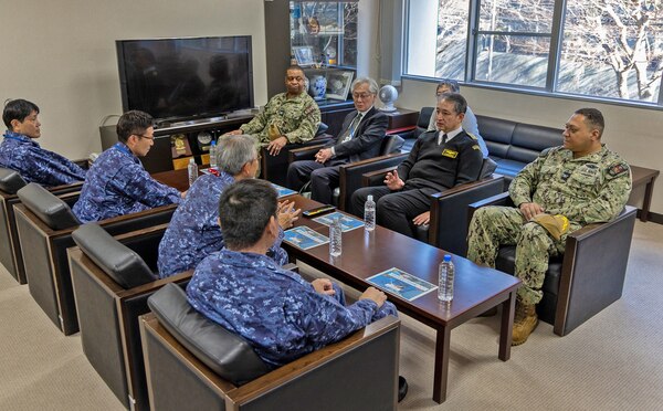 TAURA, Japan (Feb 27, 2025) Vice Adm. Tomohiko Madono, commandant, Japanese Maritime Self Defense Force Yokosuka District; U. S. Navy Medicine Readiness and Training Command (USNMRTC) Yokosuka Commanding Officer, Capt. Torrin Velazquez and Rear Adm. Satoshi Tsukazaki, Commander, Japan Self-Defense Force (JSDF) Hospital Yokosuka  discuss triage and surgical operations during a joint mass casualty drill debrief. The exercise focused on enhancing hospital administrative and command staff capabilities between NMRTC Yokosuka and JSDF Hospital Yokosuka in the event of a large-scale natural disaster, such as a major earthquake. It also provided an opportunity for U.S. and Japanese medical teams to improve emergency response capabilities through collaborative triage and surgical training. (U.S. Navy photo by Daniel Taylor/USNMRTC Yokosuka Public Affairs)