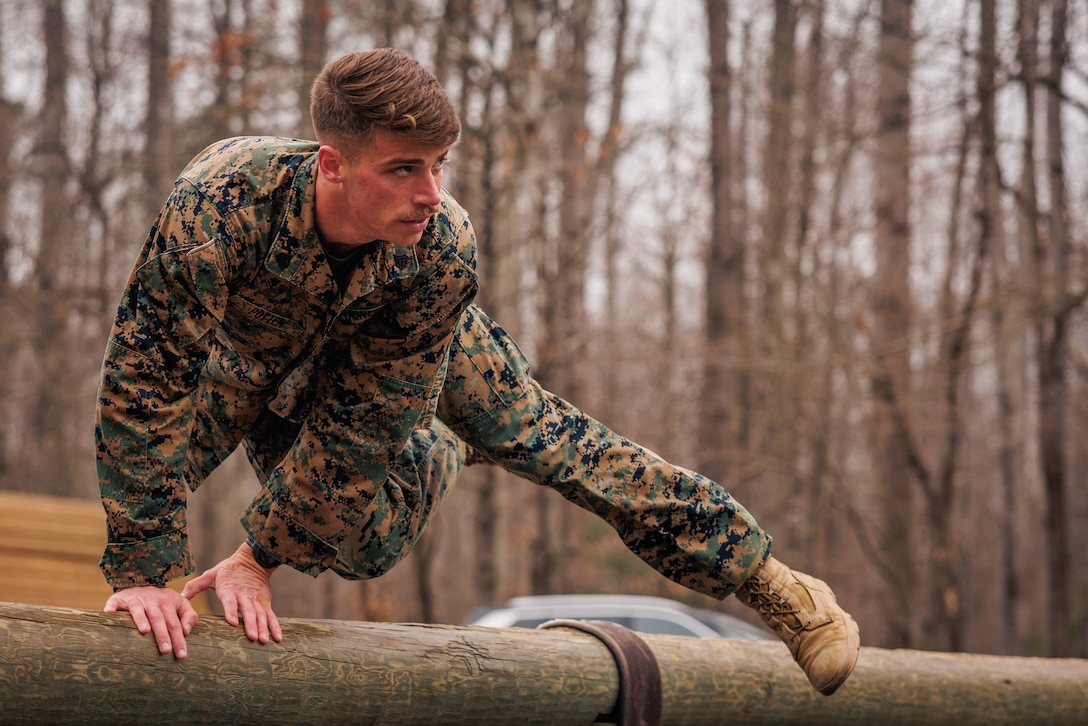 A student with the Force Fitness Instructor Course conducts the obstacle course evaluation at The Basic School on Marine Corps Base Quantico, Virginia, March 14, 2025. Marines go through a seven-week long Force Fitness Instructor Course allowing Marines to learn how to lead workouts safely and effectively by following a fitness regimen that is designed specifically to meet a unit’s fitness goals and needs. (U.S. Marine Corps photo by Lance Cpl. Braydon Rogers)