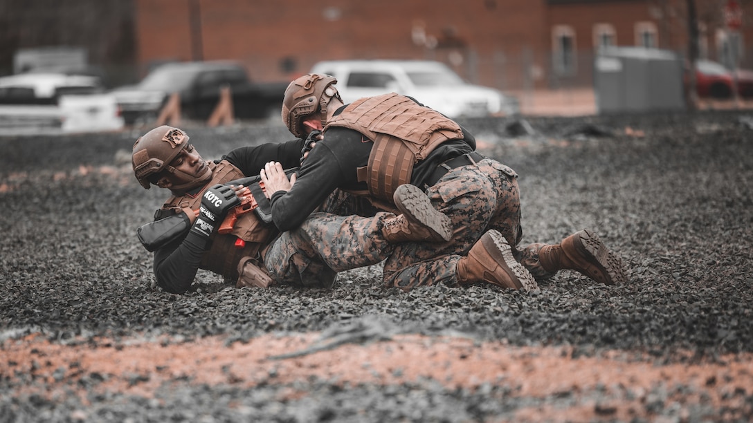U.S. Marine Corps Gunnery Sgt. Jack Pavao, martial arts instructor trainer, and Sgt. Ar’kel Brown, martial arts instructor trainer, conduct a Marine Corps Martial Arts Demonstration at The Basic School on Marine Corps Base Quantico, Virginia, March 14, 2025. The Marine Corps Martial Arts Program aims to enhance Marines' warfighting capabilities, boost self-confidence, esprit de corps, and foster a warrior ethos, focusing on physical, mental, and moral resilience. (U.S. Marine Corps photo by Lance Cpl. Ethan Miller)