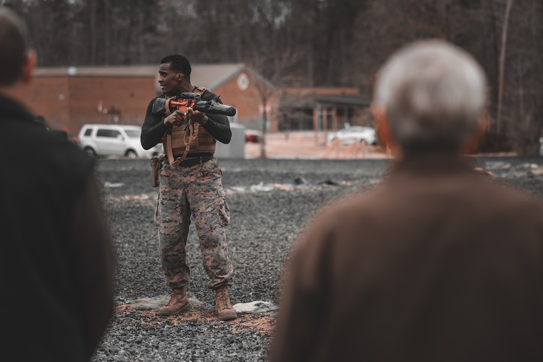 U.S. Marine Corps Sgt. Ar’kel Brown, martial arts instructor trainer, addresses the crowd during a Marine Corps Martial Arts Demonstration at The Basic School on Marine Corps Base Quantico, Virginia, March 14, 2025. The Marine Corps Martial Arts Program aims to enhance Marines' warfighting capabilities, boost self-confidence, esprit de corps, and foster a warrior ethos, focusing on physical, mental, and moral resilience. (U.S. Marine Corps photo by Lance Cpl. Ethan Miller)