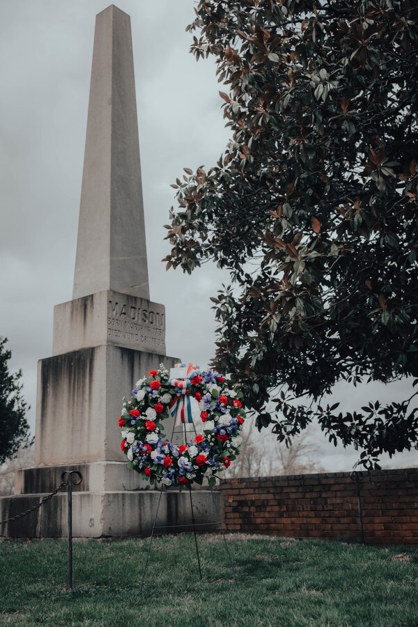 A presidential wreath is placed at the final resting place of the fourth President of the United States, James Madison, at his home at Montpelier, Orange, Virginia, March 16, 2025. This ceremony was held in commemoration of the 274th anniversary of the birthdate of President James Madison who contributed to the producing of the Constitution of the United States of America and authoring the Bill of Rights. (Marine Corps photo by Lance Cpl. Harleigh Faulk)