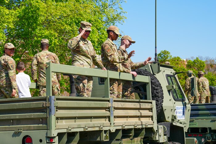 Col. Sandra Bonney, 461st Air Control Wing deputy commander, salutes attendees at the 2025 International Cherry Blossom Festival parade in downtown Macon, Georgia, March 23, 2025.