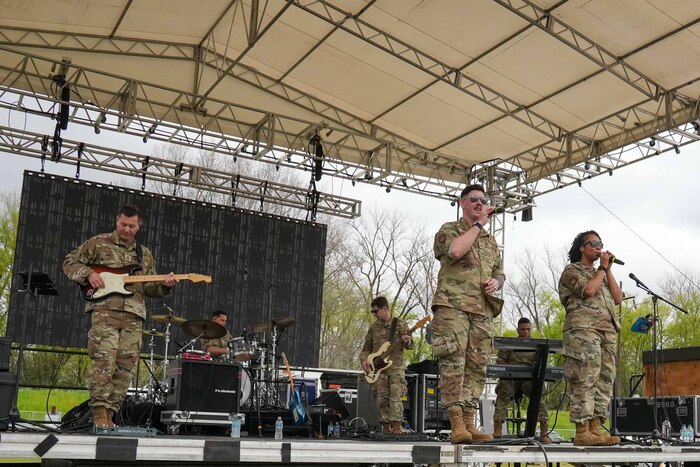 Six Airmen perform on stage