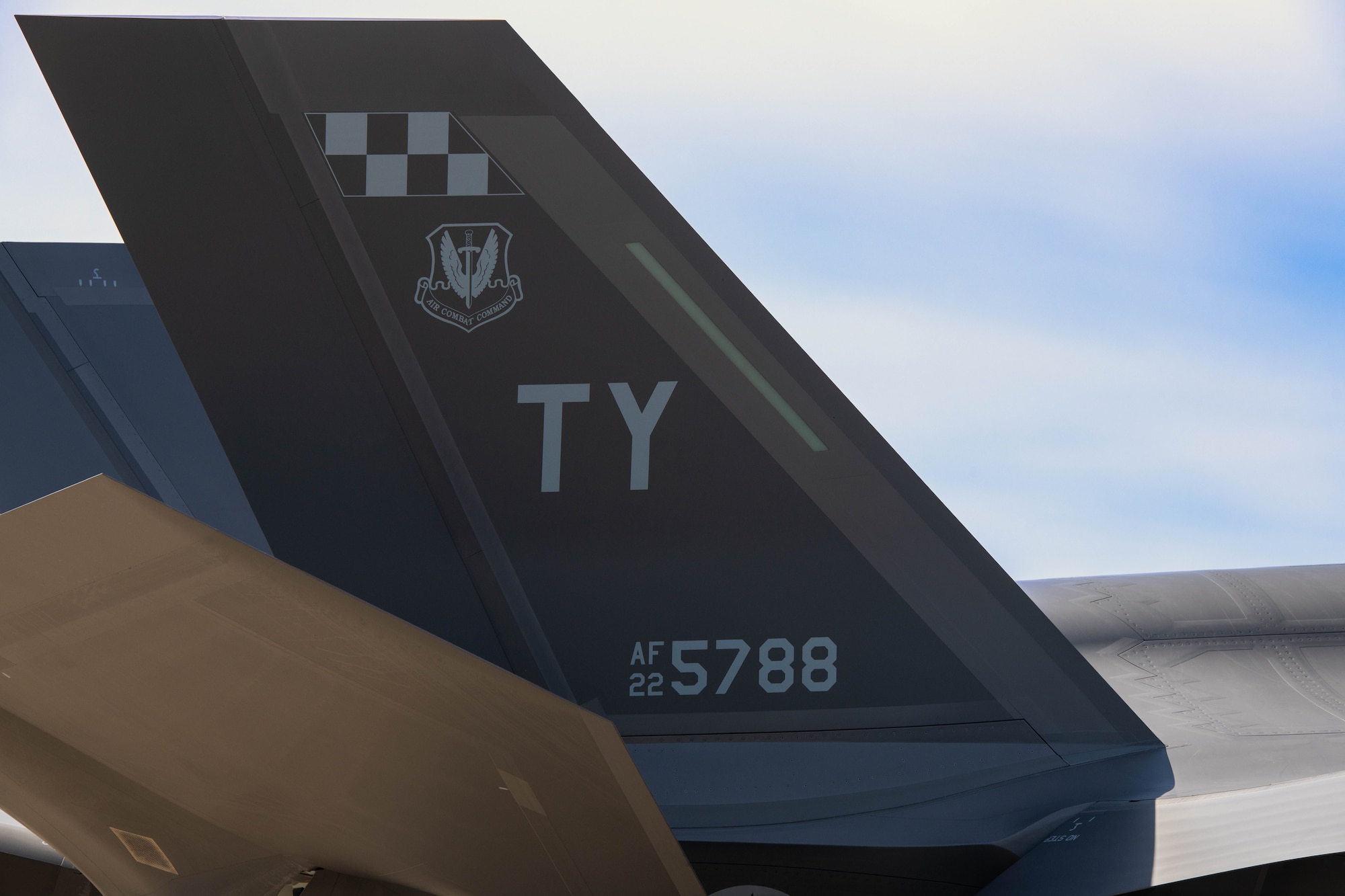 An aircraft tail showcases Tyndall letters