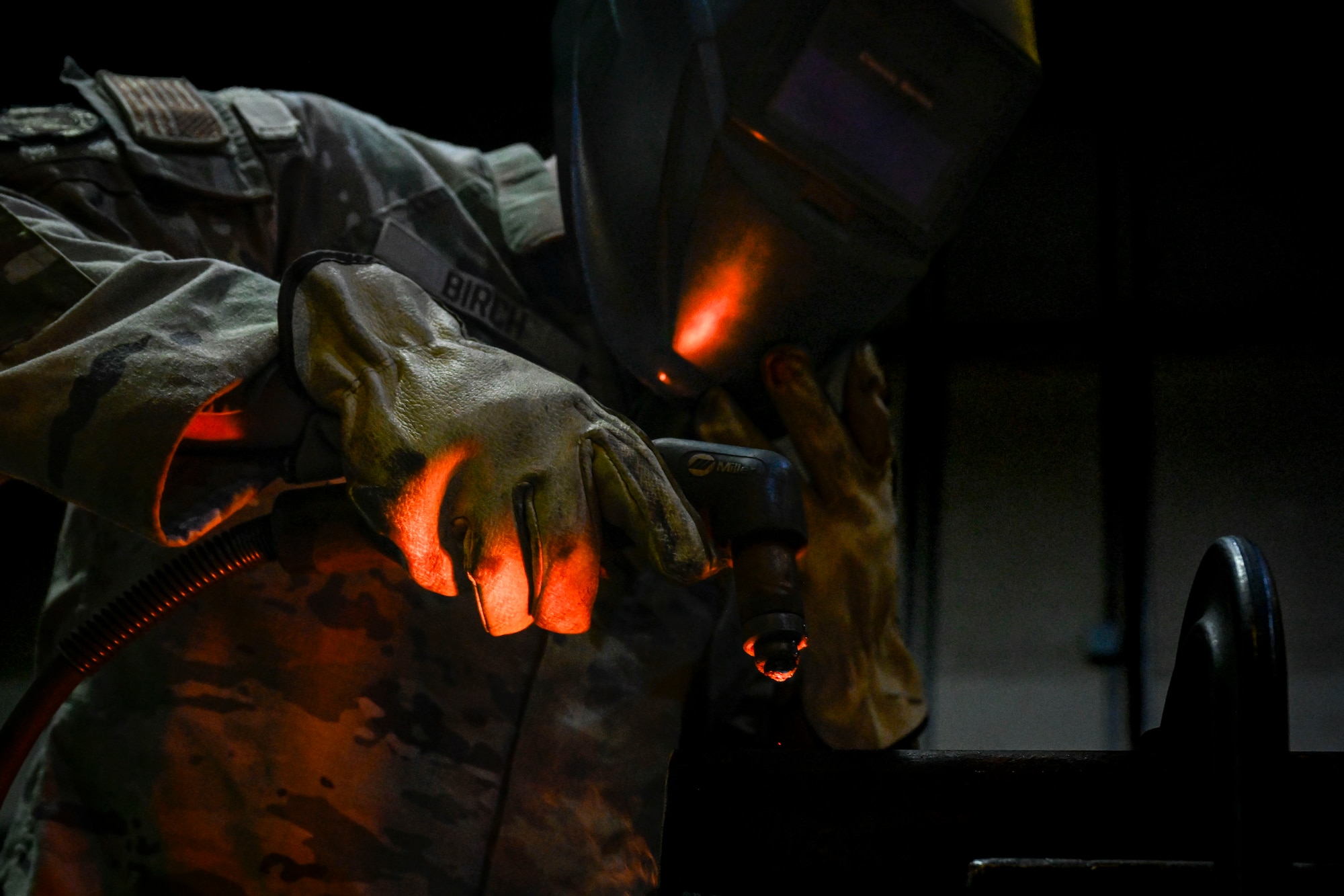 An Airman performs welding.