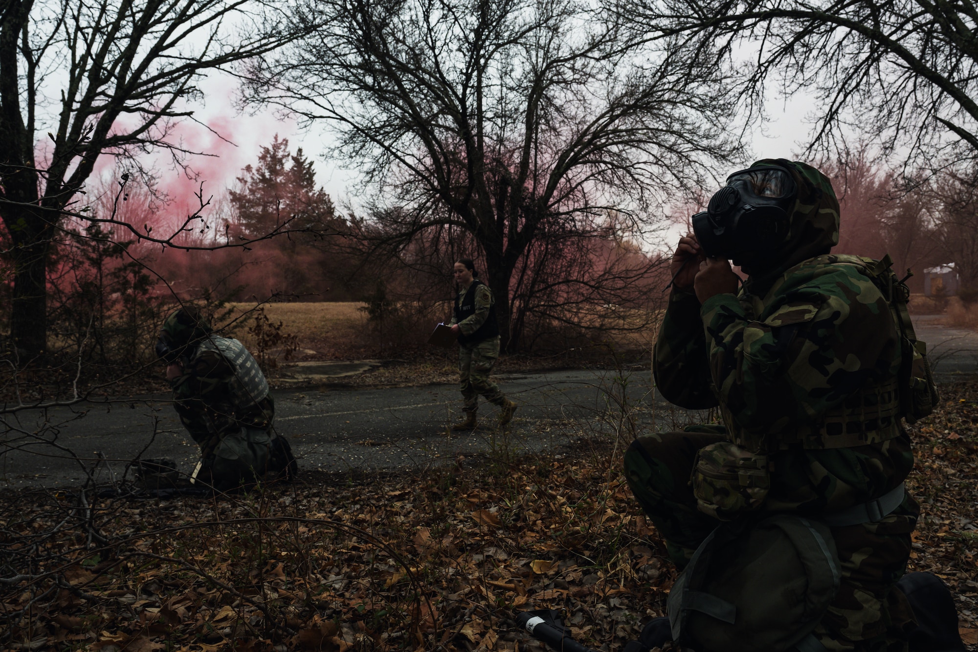 Airmen don their gas masks during a mission-oriented protective posture training.