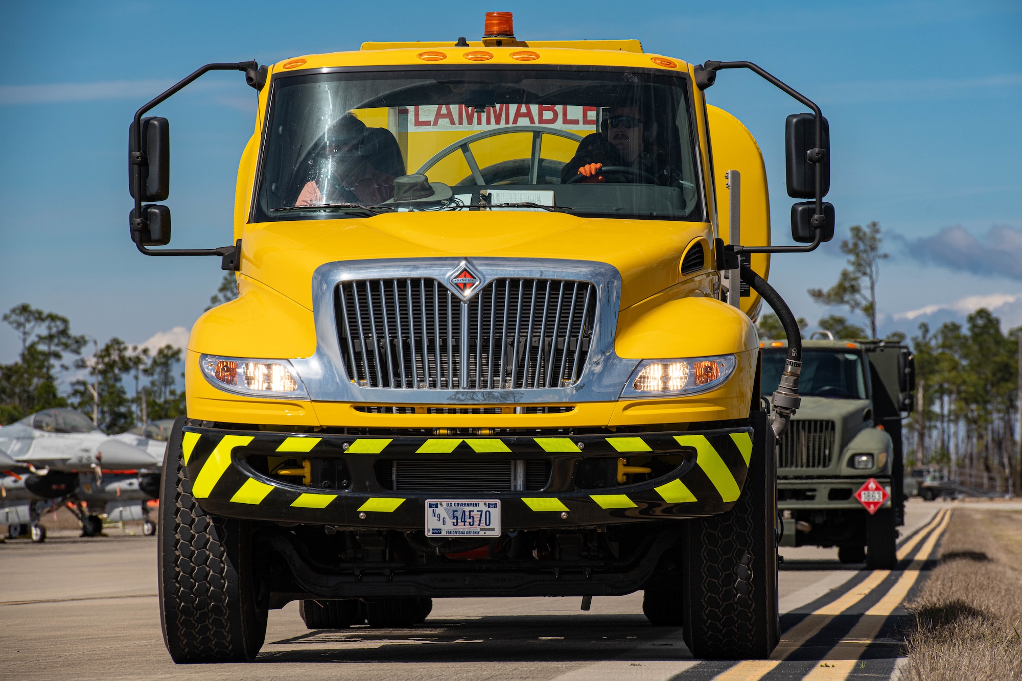 A truck sits on the flightline