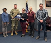 Col. Daniel Cornelius, 75th Air Base Wing commander, presents members of the Environmental Branch's Cultural Management Team at Hill Air Force Base a Department of Defense award. Members of the team include Lashonda Ford, Installation Management Division chief; Anya Kitterman – Cultural Resource Manager; Amanda Burton – Environmental Branch chief and installation tribal liaison officer, and Brody Rigby, environmental protection specialist. (Courtesy photo)