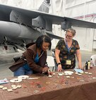 Lashonda Ford, Installation Management Division Chief, and Anya Kitterman – Cultural Resource Manager, work a table at an educational outreach event at the Hill Aerospace Museum. The duo are members of the cultural resources management team, which won a Department of Defense award. (Courtesy photo)