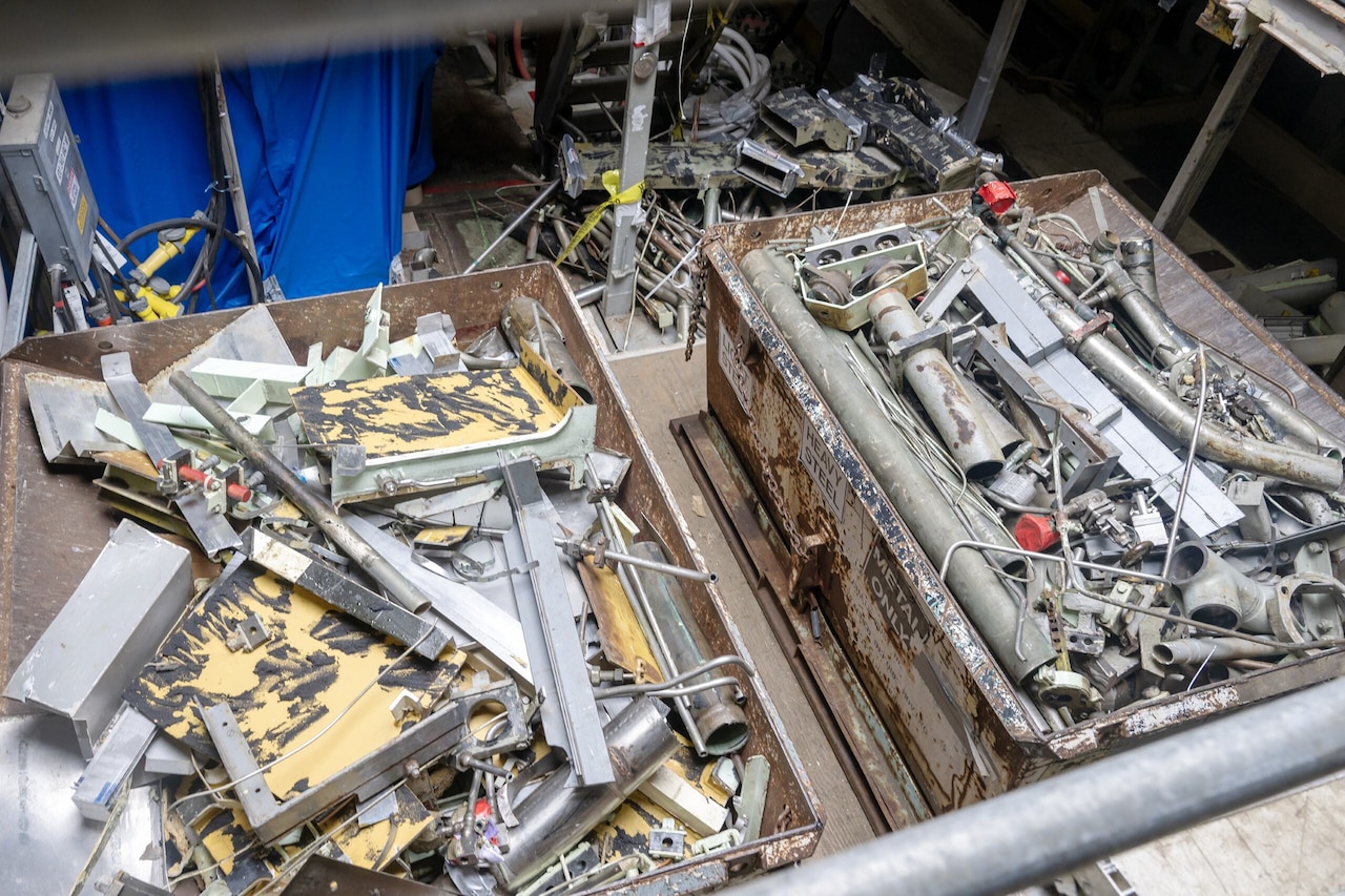 Small pieces of metal sit in bins.