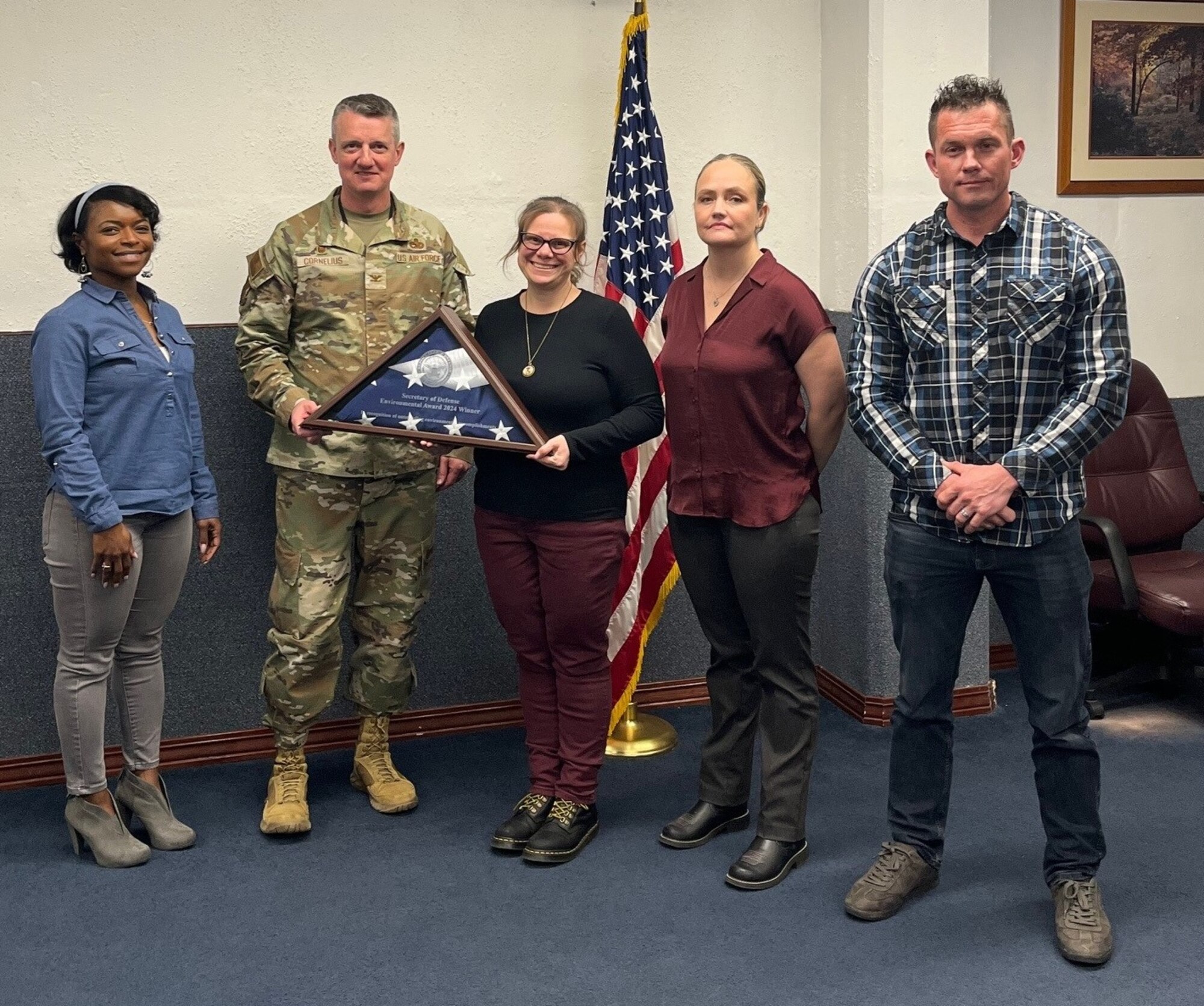 Col. Daniel Cornelius, 75th Air Base Wing commander, presents members of the Environmental Branch's Cultural Management Team at Hill Air Force Base a Department of Defense award. Members of the team include Lashonda Ford, Installation Management Division chief; Anya Kitterman – Cultural Resource Manager; Amanda Burton – Environmental Branch chief and installation tribal liaison officer, and Brody Rigby, environmental protection specialist. (Courtesy photo)