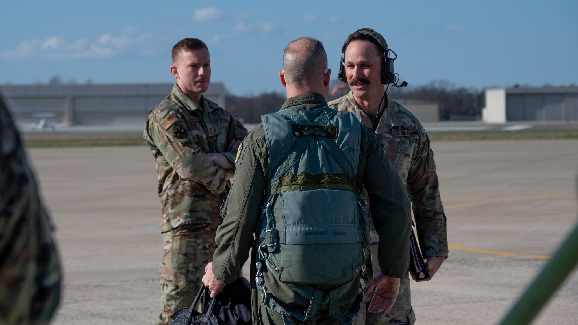 Maryland Air National Guard Lt. Col. Steven Montalvo (center), 175th Wing inspector general and A-10 pilot for the 104th Fighter Squadron, speaks with Master Sgt. Christipher Kelley (right), 175th Command Post superintendent and former A-10 crew chief, and Tech. Sgt. John McCulloch, crew chief assigned to the 175th Aircraft Maintenance Squadron, in preparation for the final flight of the A-10C Thunderbolt II aircraft 705 at Warfield Air National Guard Base at Martin State Airport at Martin State Airport, Maryland, March 26, 2025.