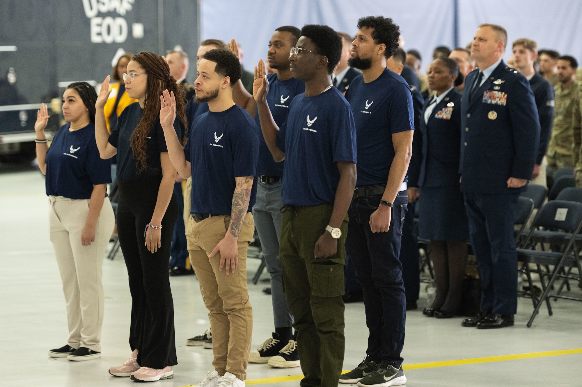 Individuals take the oath of enlistment during a Medal of Honor event hosted at Joint Base Andrews.