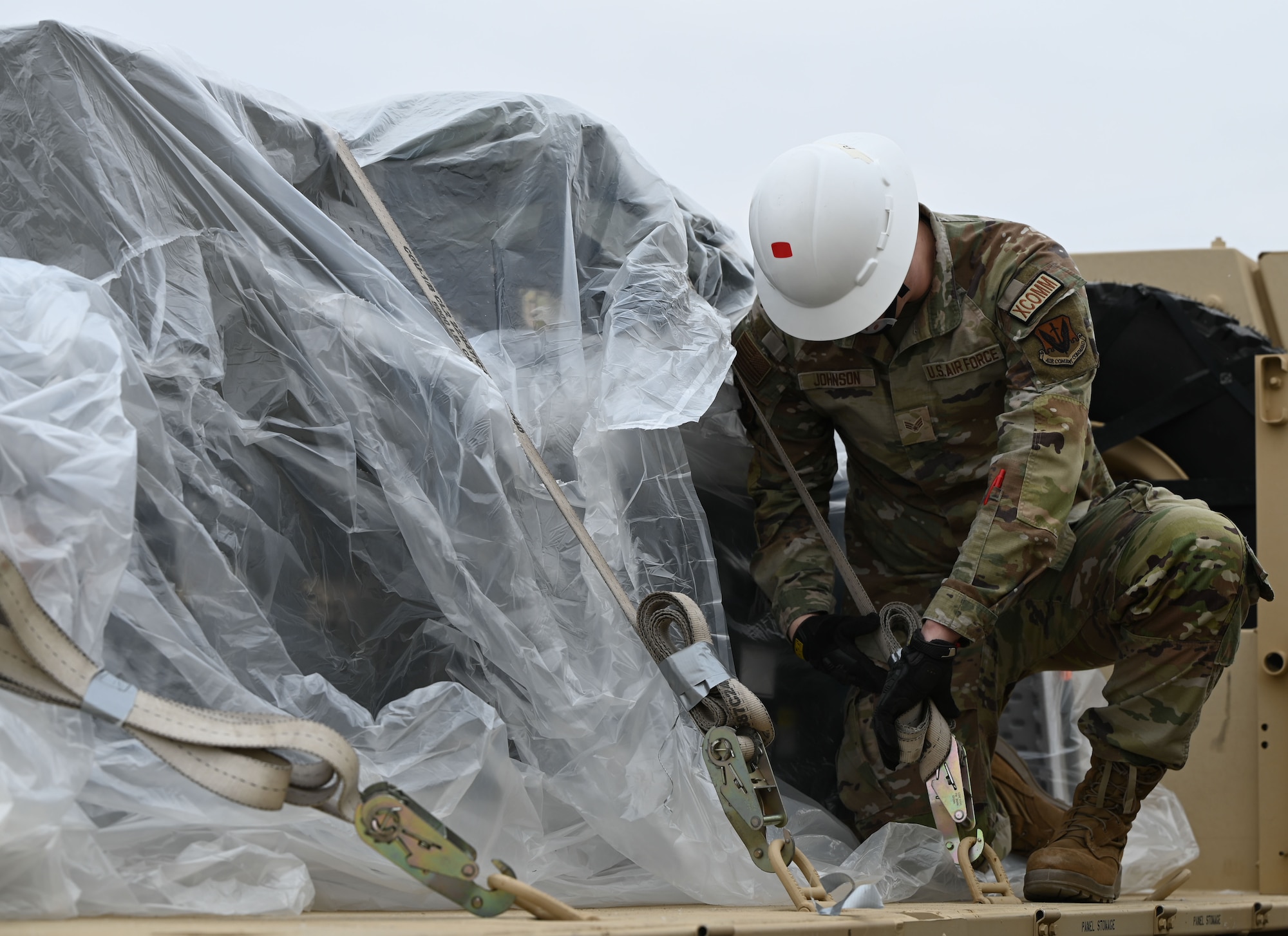 A member of the 729th Air Control Squadron tightens ratchet straps to secure cargo ahead of transport during a deployment readiness exercise at Hill Air Force Base, Utah, Jan. 15, 2025. Airmen performed hands-on preparation for upcoming large-scale exercises.
(U.S. Air Force photo by Garrett N. Cole)