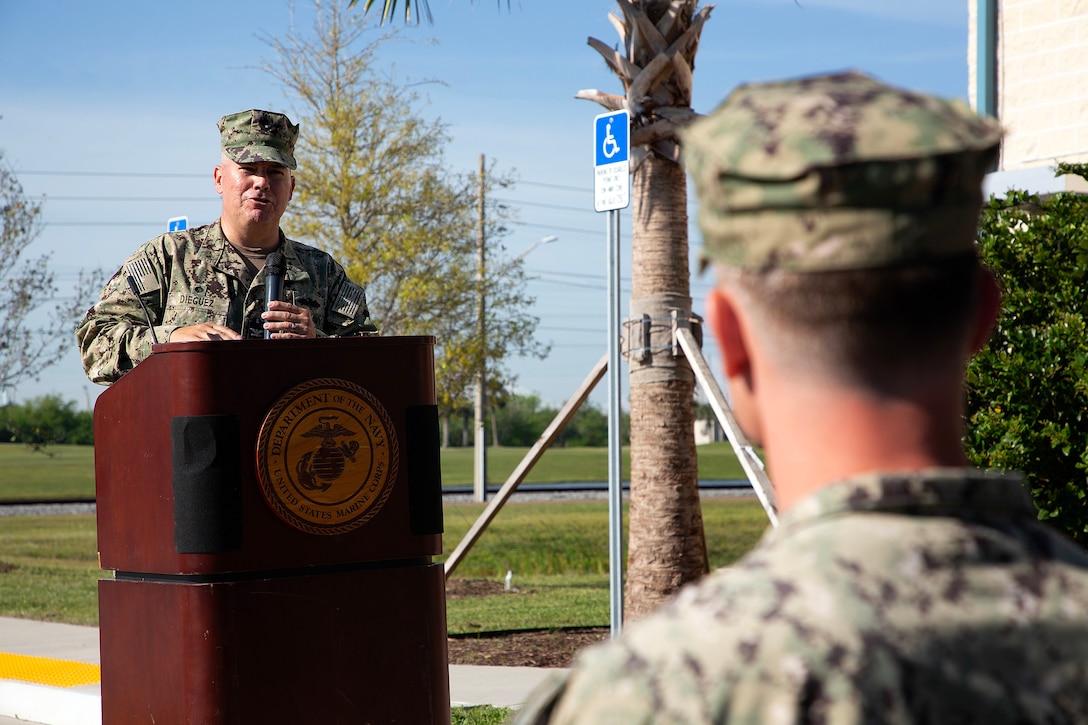 U.S. Navy Capt. Miguel Dieguez, commanding officer of Navy Facilities Southeast, speaks during a ribbon-cutting ceremony March 26 at Marine Corps Support Facility Blount Island in Jacksonville, Florida. A new $14.2 million police station and emergency operations center opened on the facility, consolidating vital functions into a single, hardened structure and enhancing protection for Marine Corps' prepositioning programs. The up to date, 18,500-square-foot building combines the former police station and emergency operations center, which had been in structures vulnerable to hurricanes.