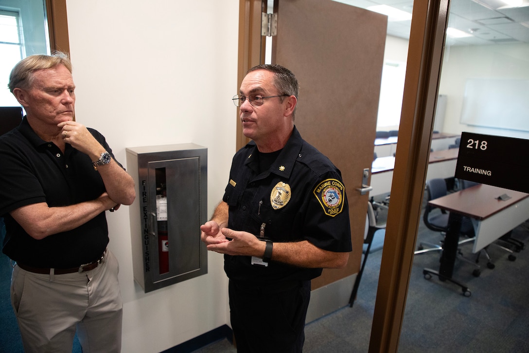 Timothy Jenkins, interim police chief, explains a training space after a ribbon-cutting ceremony March 26 at Marine Corps Support Facility Blount Island in Jacksonville, Florida. A new $14.2 million police station and emergency operations center opened on the facility, consolidating vital functions into a single, hardened structure and enhancing protection for Marine Corps' prepositioning programs. The up to date, 18,500-square-foot building combines the former police station and emergency operations center, which had been in structures vulnerable to hurricanes.