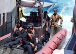 Coast Guard Cutter Midgett’s (WMSL 757) law enforcement team and Papua New Guinea shipriders return after a boarding in Papua New Guinea’s exclusive economic zone, Mar. 11, 2025. Papua New Guinea lies in the heart of key shipping routes and lucrative fisheries. The U.S. Coast Guard and Papua New Guinea collaborate to mitigate shared maritime challenges and threats, promoting regional security and stability within Oceania. (U.S. Coast Guard photo by Petty Officer 3rd Class Jennifer Nilson)