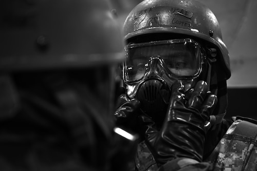 U.S. Air Force Senior Airman Cooper Hartzos, 51st Maintenance Squadron fuel systems maintainer, receives a buddy check during a simulated Alarm Black scenario as part of Freedom Shield 25 at Suwon Republic of Korea Air Base, March 11, 2025. The five MOPP levels–MOPP 0 through MOPP 4–adjust protection measures against chemical, biological, radiological, nuclear, and explosive threats, like attack signal warnings. A core training objective of FS25 is de-escalation and implementation of Armistice mechanisms to prevent conflict. (U.S. Air Force photo by Senior Airman Sabrina Fuller-Judd)