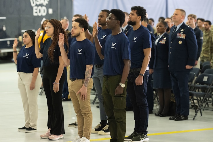 Individuals take the oath of enlistment during a Medal of Honor event hosted at Joint Base Andrews.