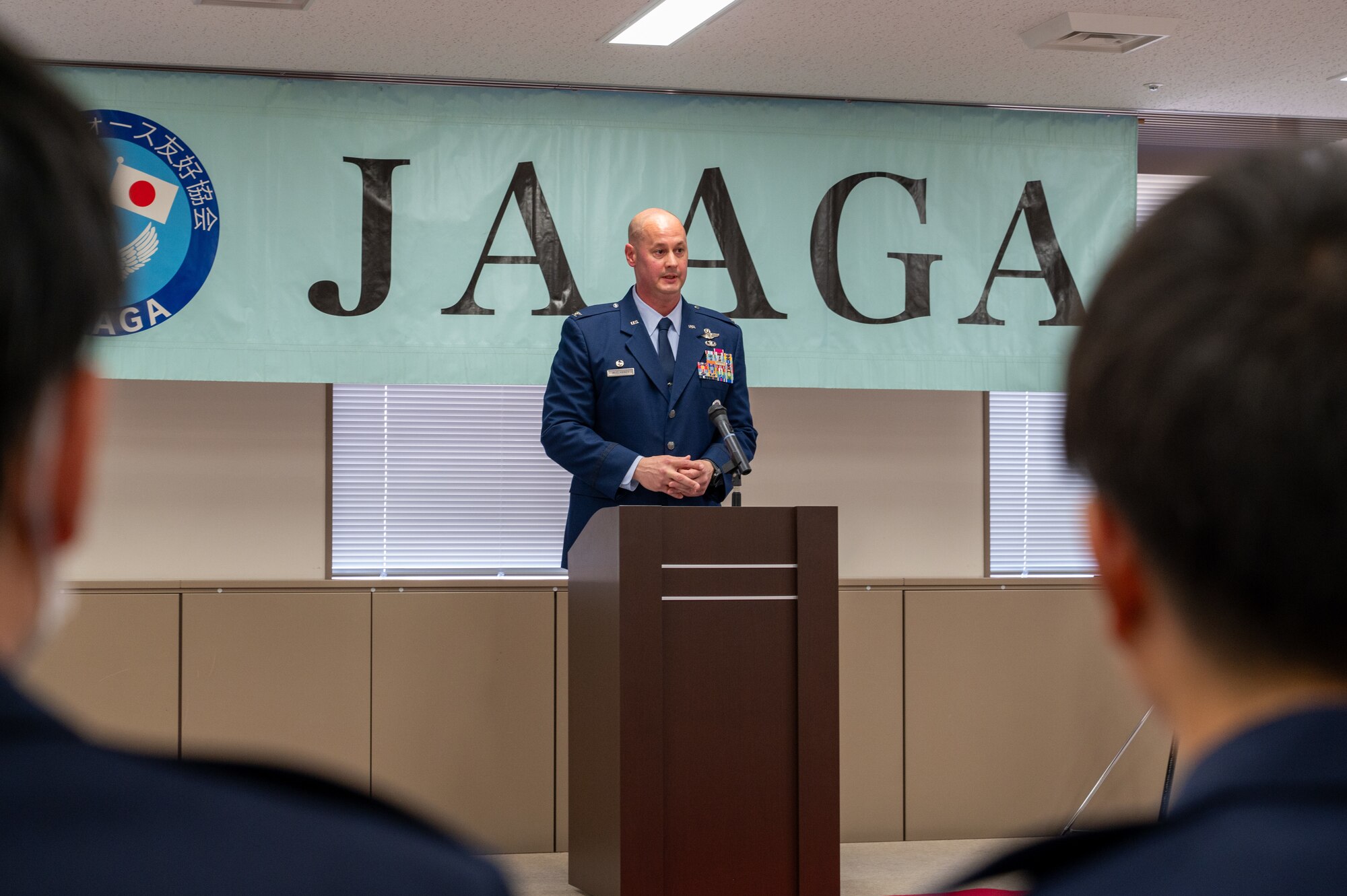 U.S. Air Force Col. Richard McElhaney, 374th Airlift Wing commander, delivers remarks during the Japan-America Air Force Goodwill Association Award Ceremony at Yokota Air Base, Japan.