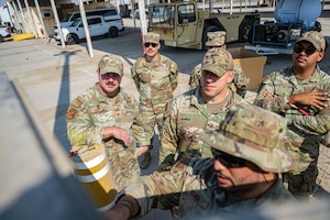 U.S. Air Force Col. Paul Sheets, 380th Air Expeditionary Wing commander, and Chief Master Sgt. Joshua Skarloken, 380th AEW command chief, spectates a quarterly PA check within the U.S. Central Command area of responsibility, March. 18, 2025. Wing leadership engaged with radio frequency specialists to understand how they sustain and enhance tactical communication networks, keeping aircraft, command centers, and deployed units connected in dynamic operational environments. (U.S. Air Force photo by Senior Airman Sir Wyrick)