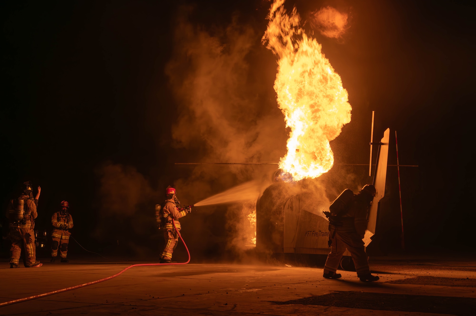 Firefighters put out a simulated fire