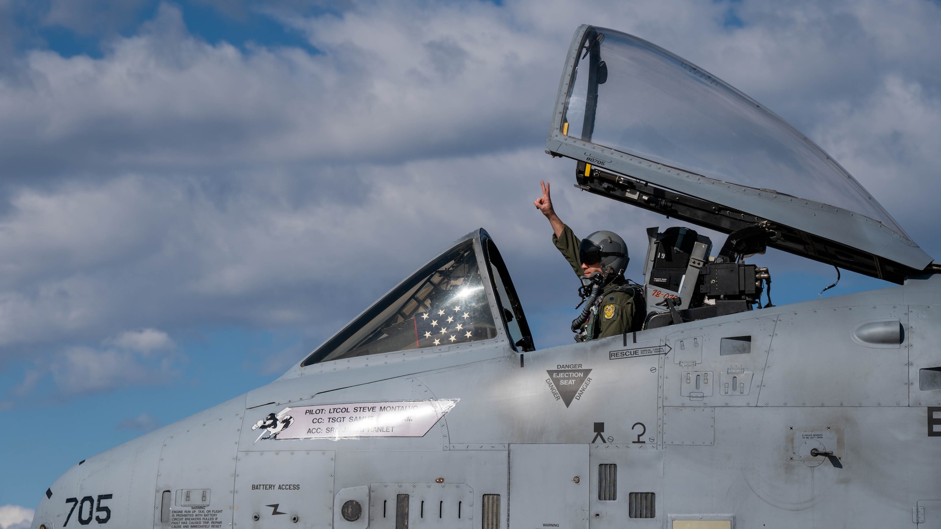 Maryland Air National Guard Lt. Col. Steven Montalvo, 175th Wing inspector general and A-10 pilot for the 104th Fighter Squadron, gestures farewell to fellow Guard members while taxiing to the runway in the A-10C Thunderbolt II aircraft 705 at Warfield Air National Guard Base at Martin State Airport, Maryland, March 26, 2025. The aircraft was the first to be sent from the 175th Wing to the boneyard at Davis-Monthan Air Force Base, Tucson, Arizona, as part of the initial process of divesting the Maryland Air National Guard A-10C Thunderbolt II fleet.
