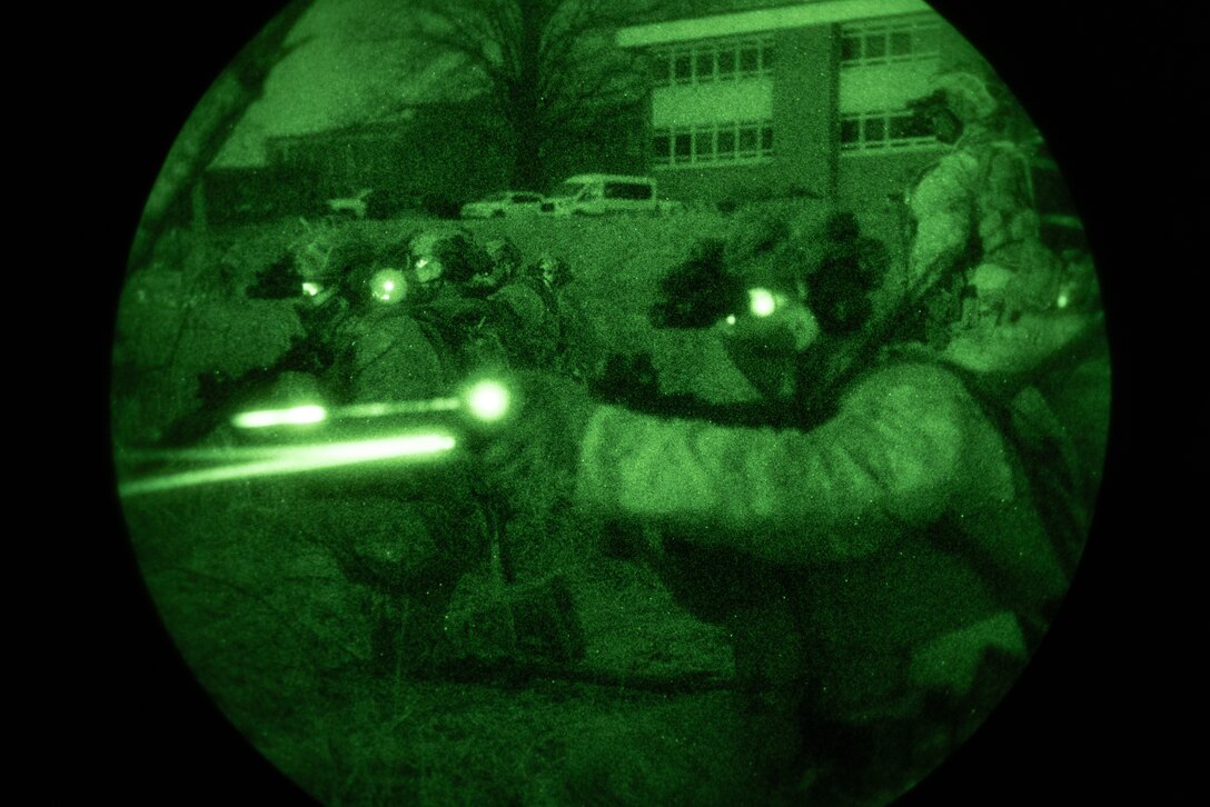 U.S. Marines with Maritime Special Purpose Force, 22nd Marine Expeditionary Unit (MEU), engage simulated combatants during a raid for realistic urban training (RUT) in Lynchburg, Virginia, Mar. 19, 2025. RUT, an exercise hosted by Expeditionary Operations Training Group (EOTG), is comprised of different training scenarios that enable the 22nd MEU to train as a cohesive Marine Air-Ground Task Force. EOTG trains II Marine Expeditionary Force units in preparation for upcoming deployments in support of geographic combatant commands. (U.S. Marine Corps photo by Lance Cpl. Kyle Baskin)