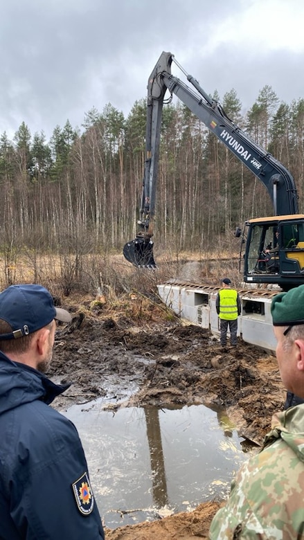 Lithuanian soldiers aiding in rescue operations.