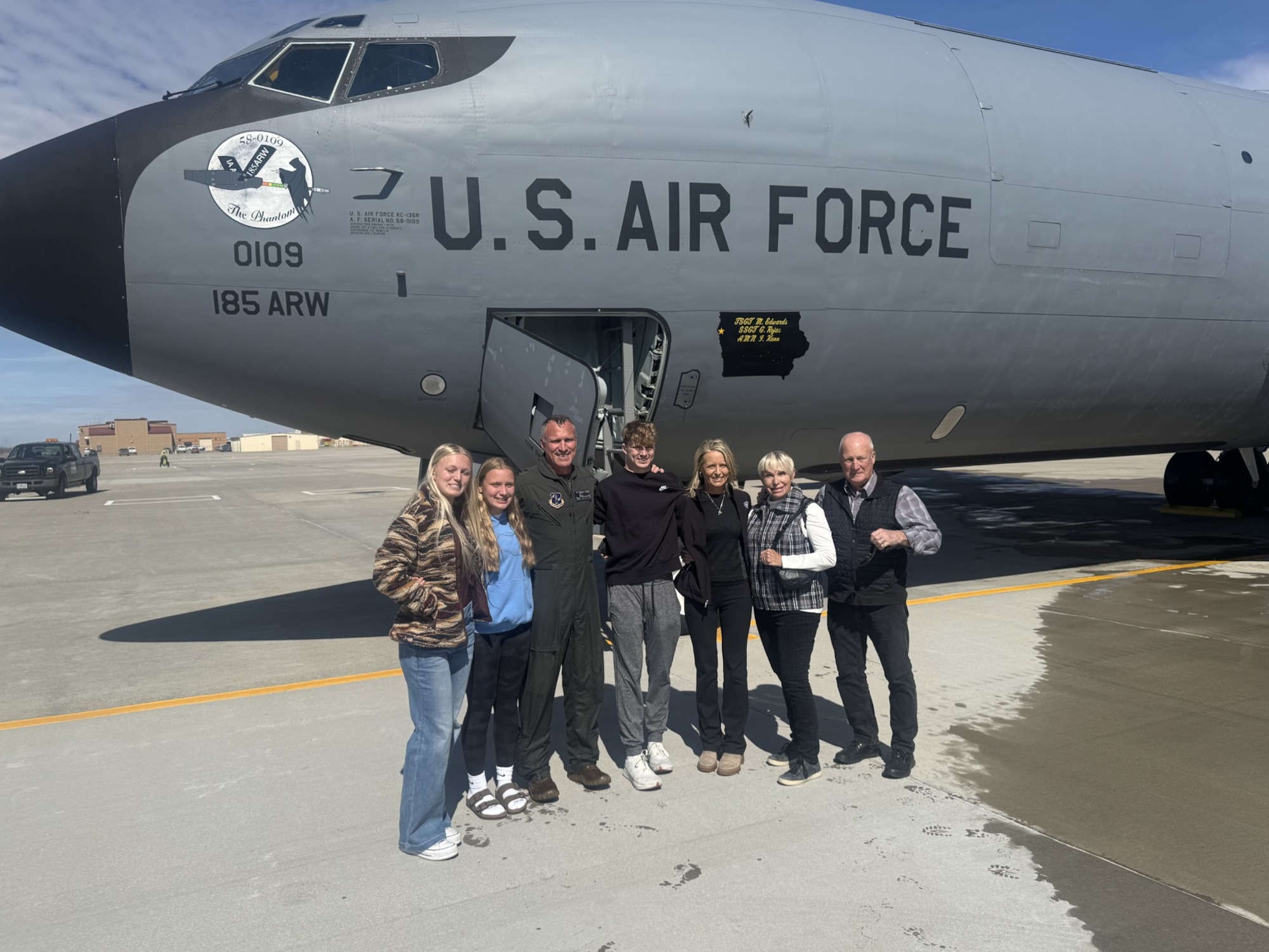 U.S. Air National Guard Col. Todd “Freak” Miller, former 185th Operations Group Commander, poses for a photo with family in front of a U.S. Air Force KC-135 Stratotanker
